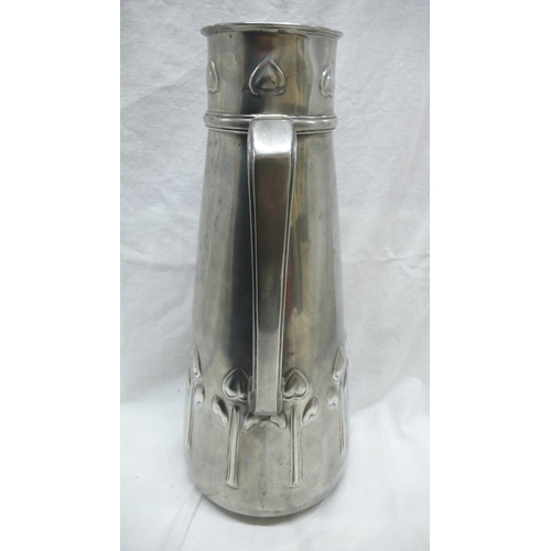 47 - Liberty & Co. Tudric Pewter large jug with stylized tulip decoration, No. 051, Ht. 34.5 cms