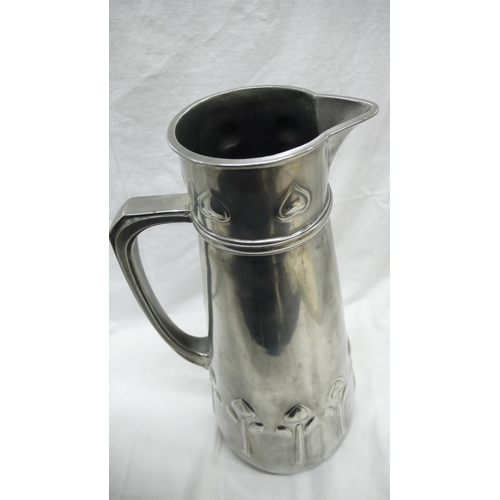 47 - Liberty & Co. Tudric Pewter large jug with stylized tulip decoration, No. 051, Ht. 34.5 cms