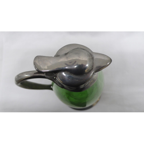 8 - Archibald Knox for Liberty & Co. Tudric Pewter and Whitefriars green glass jug with heart shaped lea... 