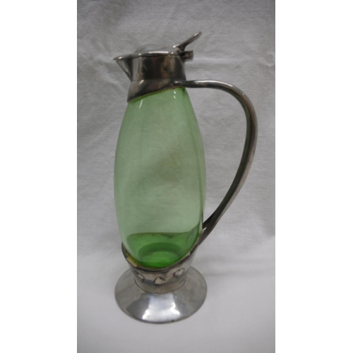 8 - Archibald Knox for Liberty & Co. Tudric Pewter and Whitefriars green glass jug with heart shaped lea... 