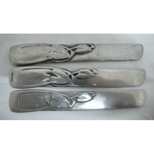 26 - Archibald Knox for Liberty & Co. three Tudric Pewter butter knives with stylized leaf and stem decor... 