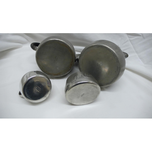 49 - Archibald Knox for Liberty & Co - Tudric Pewter four piece coffee service with stylized leaf decorat... 