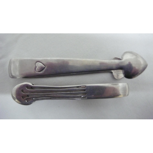 52 - Archibald Knox for Liberty & Co - Cymric silver, two sets of sugar tongs, Birmingham 1903 and 1905