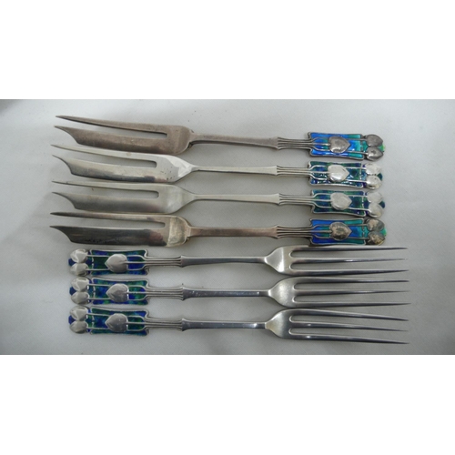 57 - Archibald Knox for Liberty & Co - seven silver and blue green enamel, pastry and fruit forks with Me... 