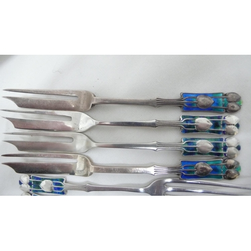 57 - Archibald Knox for Liberty & Co - seven silver and blue green enamel, pastry and fruit forks with Me... 