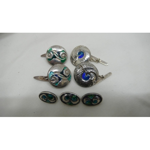 61 - Archibald Knox for Liberty & Co - two pairs of Cymric cuff links and three silver and enamel buttons... 