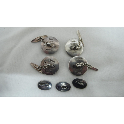 61 - Archibald Knox for Liberty & Co - two pairs of Cymric cuff links and three silver and enamel buttons... 