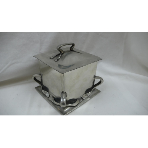 87 - Liberty & Co - Tudric Pewter square shaped biscuit box with handle to top and ribbon decoration to s... 