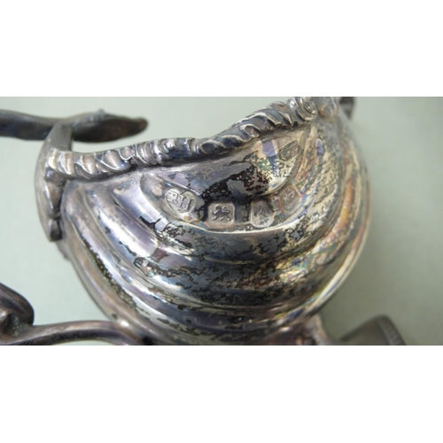 23 - Late Victorian silver scallop shell sauce boat with sea snake handle on a diamond shaped base - Birm... 