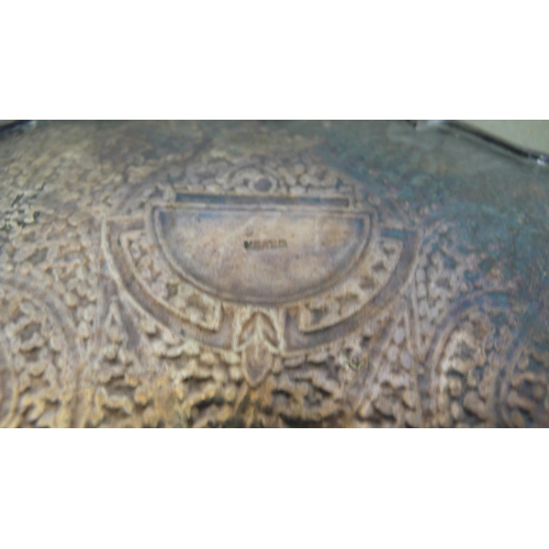 26 - Middle Eastern silver dish with shaped border and intricately engraved decoration - 11 ozt