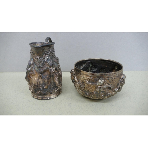 39 - Indian silver cream jug and sugar with decoration of figures in relief - Ht. of Jug 2.25 ins