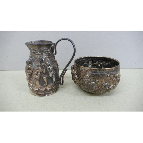 39 - Indian silver cream jug and sugar with decoration of figures in relief - Ht. of Jug 2.25 ins