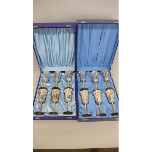 51 - A set of twelve silver gilt wine goblets with flared tops, bark stems and circular foot - Birmingham... 