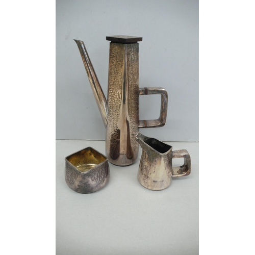 52 - Designer three piece silver four sided coffee service with a brick wall decoration - Maker John Mich... 