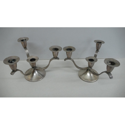 54 - A pair of designer silver three branch candelabra with three reeded arms on circular base.  Birmingh... 