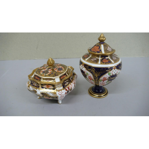 105 - Two Royal Crown Derby Imari pattern urns with finials - tallest 4.5 ins - 1920 & 1939