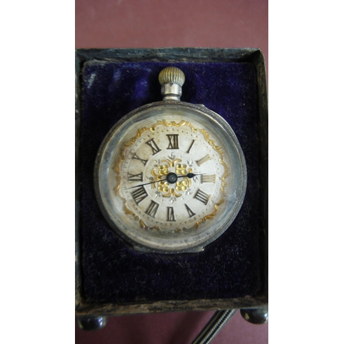 122 - Edwardian chased silver case to hold a small top winding pocket watch - Ht. 2.75 ins plus another si... 