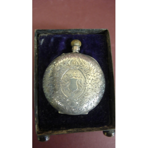 122 - Edwardian chased silver case to hold a small top winding pocket watch - Ht. 2.75 ins plus another si... 