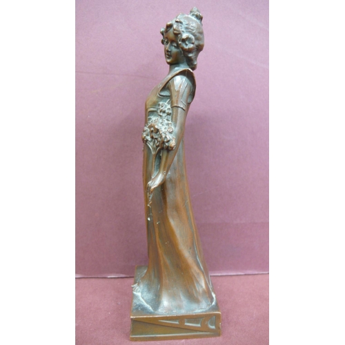 124 - Art Nouveau bronze figure of a girl standing holding flowers - Ht. 6.5 ins