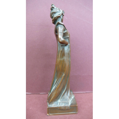 124 - Art Nouveau bronze figure of a girl standing holding flowers - Ht. 6.5 ins