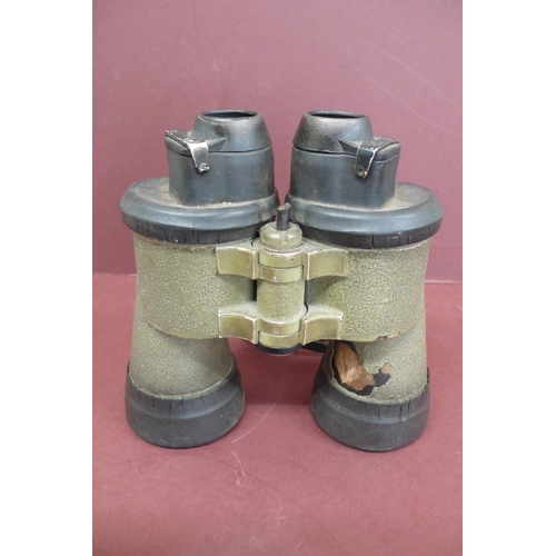 133 - A pair of 7 x 50 Kriegsmarine U boat binoculars by Carl Zeiss.  Green rubberised  casing, fixed focu... 