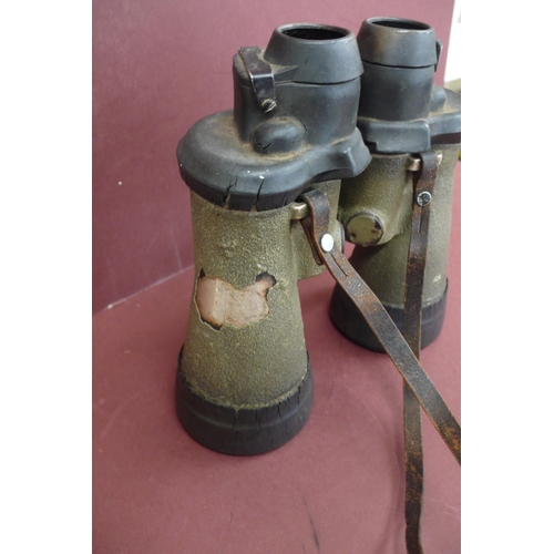 133 - A pair of 7 x 50 Kriegsmarine U boat binoculars by Carl Zeiss.  Green rubberised  casing, fixed focu... 