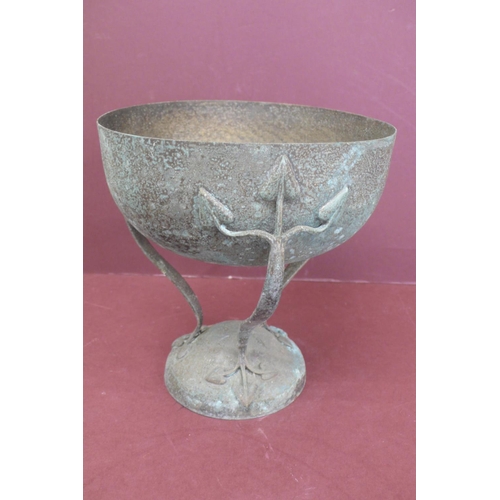 141 - Art Nouveau hammered metal tazza on curved legs with leaf decoration to top and bottom on raised cir... 