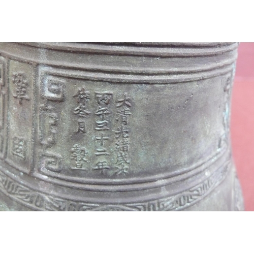 142 - Chinese bronze bell with decoration of animal masks to top and Chinese characters and symbols to bod... 