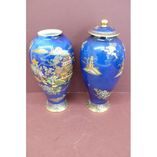 147 - Pair of Carlton ware baluster shaped pottery vases with chinoiserie decoration on a dark blue ground... 