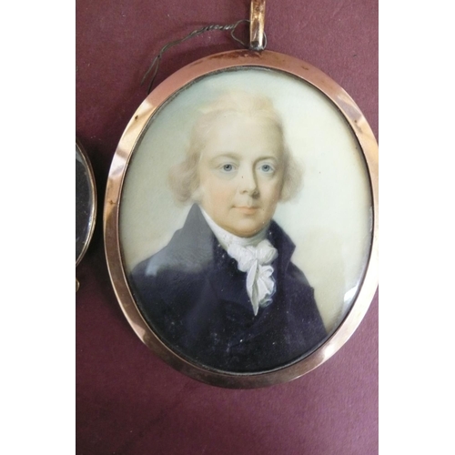 163 - Three well painted Georgian oval miniatures of men set in gold frames - largest ht. 2.6 ins