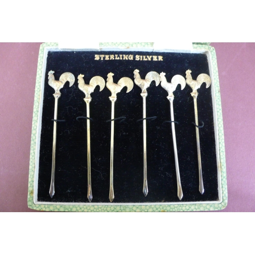 166 - A set of sterling silver gilt cocktail sticks (cased)