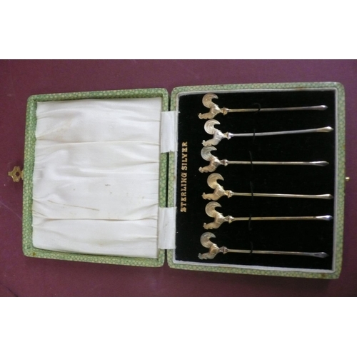 166 - A set of sterling silver gilt cocktail sticks (cased)