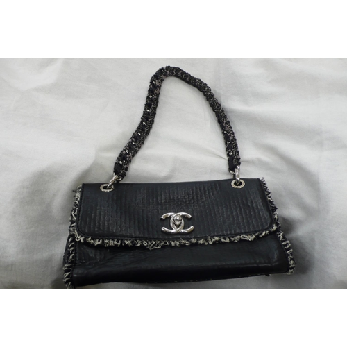 196 - Chanel black leather tweedy flap bag - having plaited material and chrome link handle, chrome fittin... 