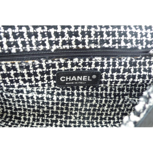 196 - Chanel black leather tweedy flap bag - having plaited material and chrome link handle, chrome fittin... 