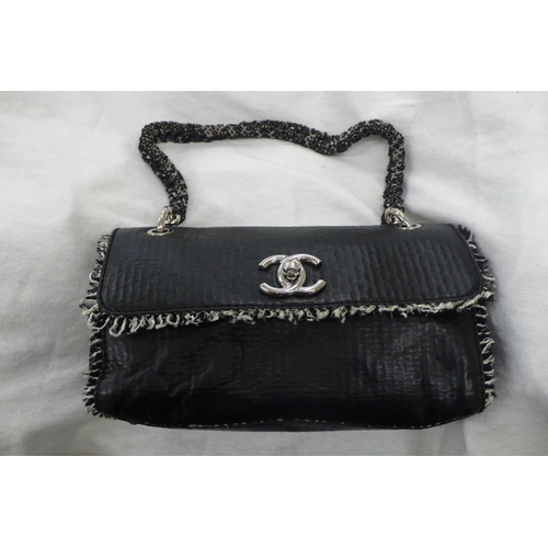 196 - Chanel black leather tweedy flap bag - having plaited material and chrome link handle, chrome fittin... 