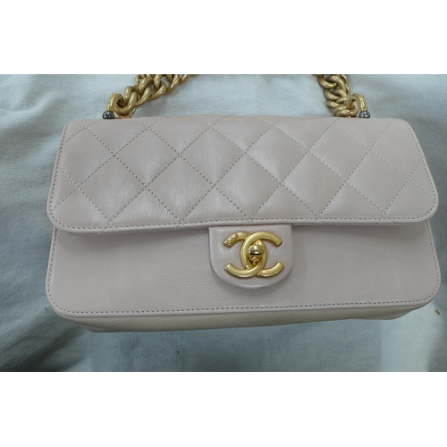 198 - Chanel straight line flap bag, quilted pale pink leather with gold plated long and short handles, go... 