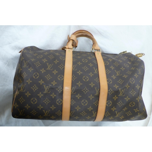 203 - Louis Vuitton Paris 'womans keepall' imitation dark brown leather with LV designs, tan leather handl... 