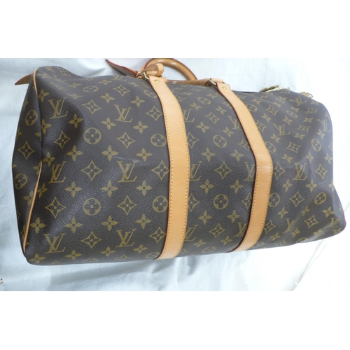 203 - Louis Vuitton Paris 'womans keepall' imitation dark brown leather with LV designs, tan leather handl... 