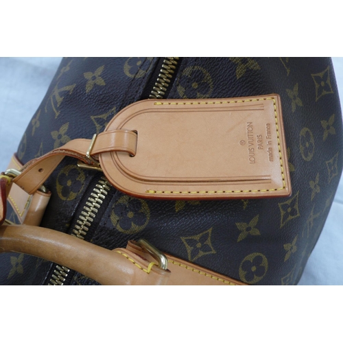 203 - Louis Vuitton Paris 'womans keepall' imitation dark brown leather with LV designs, tan leather handl... 