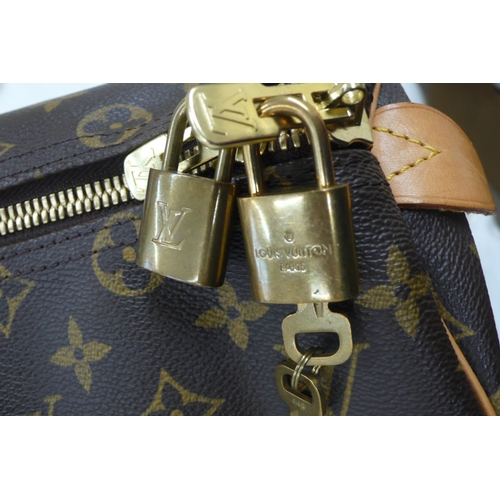 203 - Louis Vuitton Paris 'womans keepall' imitation dark brown leather with LV designs, tan leather handl... 