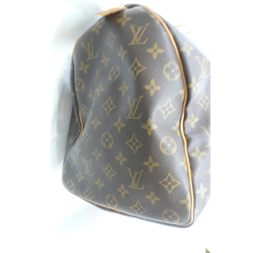 203 - Louis Vuitton Paris 'womans keepall' imitation dark brown leather with LV designs, tan leather handl... 