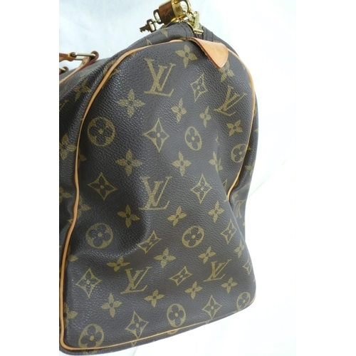 203 - Louis Vuitton Paris 'womans keepall' imitation dark brown leather with LV designs, tan leather handl... 