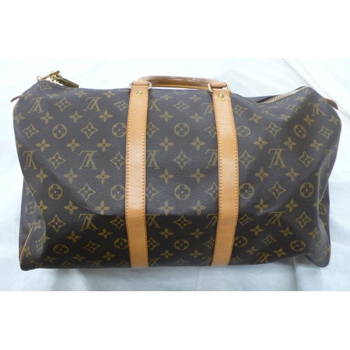 203 - Louis Vuitton Paris 'womans keepall' imitation dark brown leather with LV designs, tan leather handl... 