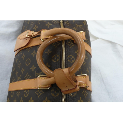 203 - Louis Vuitton Paris 'womans keepall' imitation dark brown leather with LV designs, tan leather handl... 