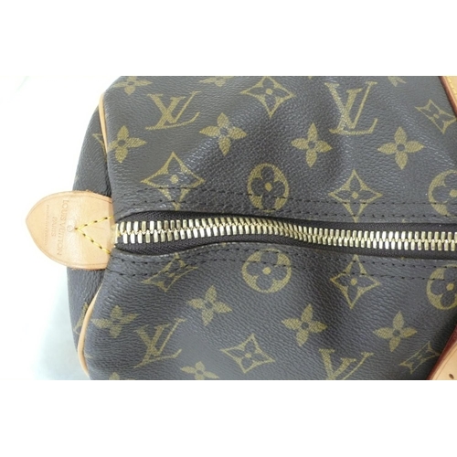 203 - Louis Vuitton Paris 'womans keepall' imitation dark brown leather with LV designs, tan leather handl... 