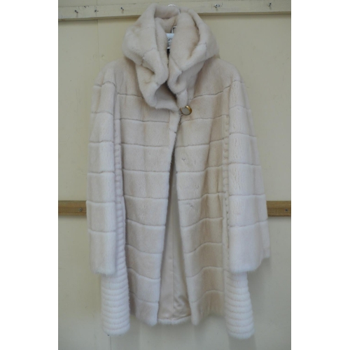 209 - Ladies blond mink mid length coat with hood having a layered design size 12, platinum quality by Kop... 