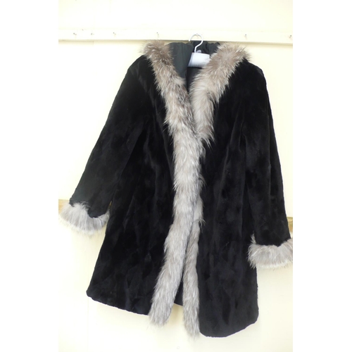 211 - Ladies reversible shower proof cropped black mink mid length coat with hood having silver fox fur tr... 