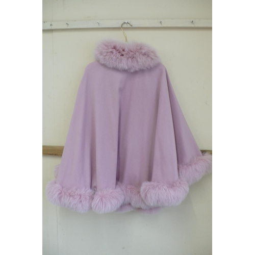 212 - Ladies pink cashmere poncho with pink fox fur collar, trim and pom poms size 12