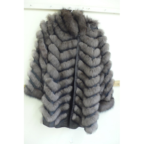 217 - Ladies reversible shower proof brown fox fur coat in a chevron pattern size 12/14 with hood