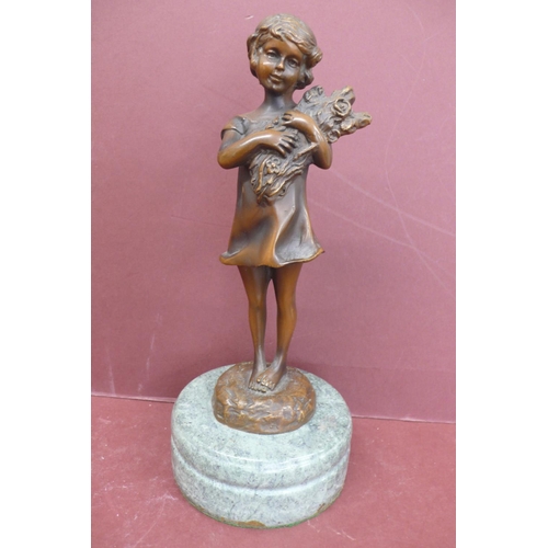 228 - S. Buzard? 20thC young girl holding firewood, brown patinated bronze on a green marble base signed, ... 